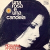 copertina di UNA ROSA E UNA CANDELA/CARITÀ 